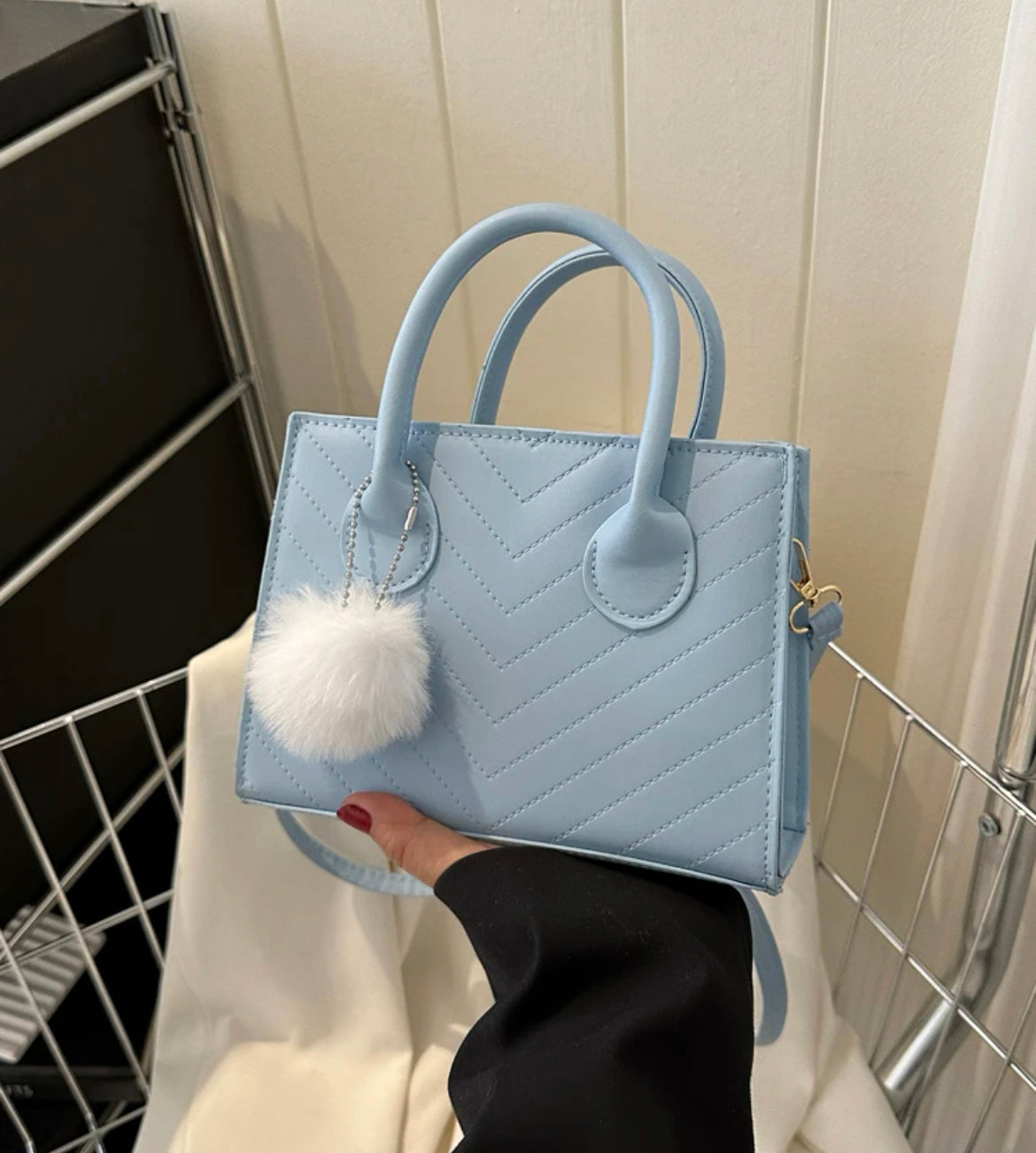 Baby blue mini bag with pompom