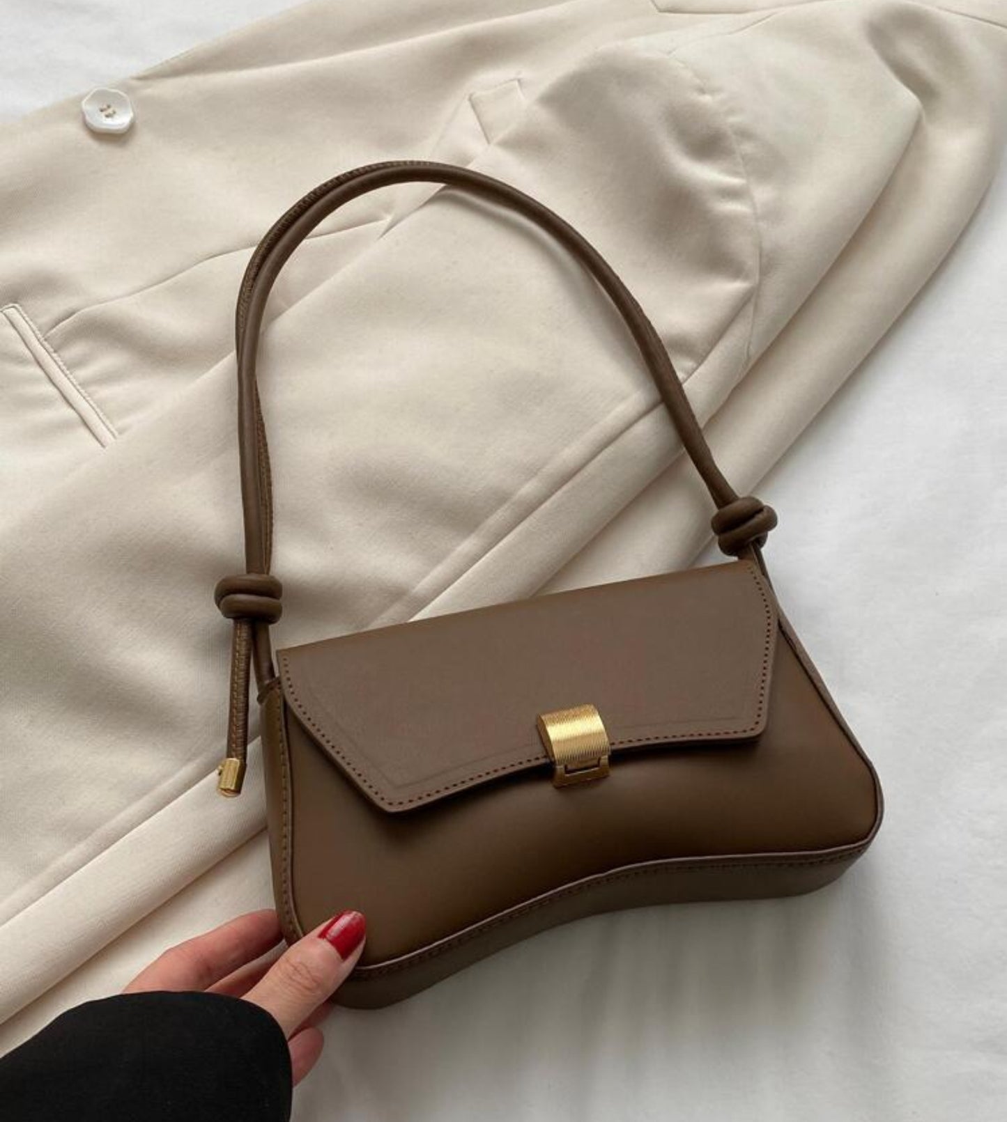Dark brown baguette bag with gold detailing
