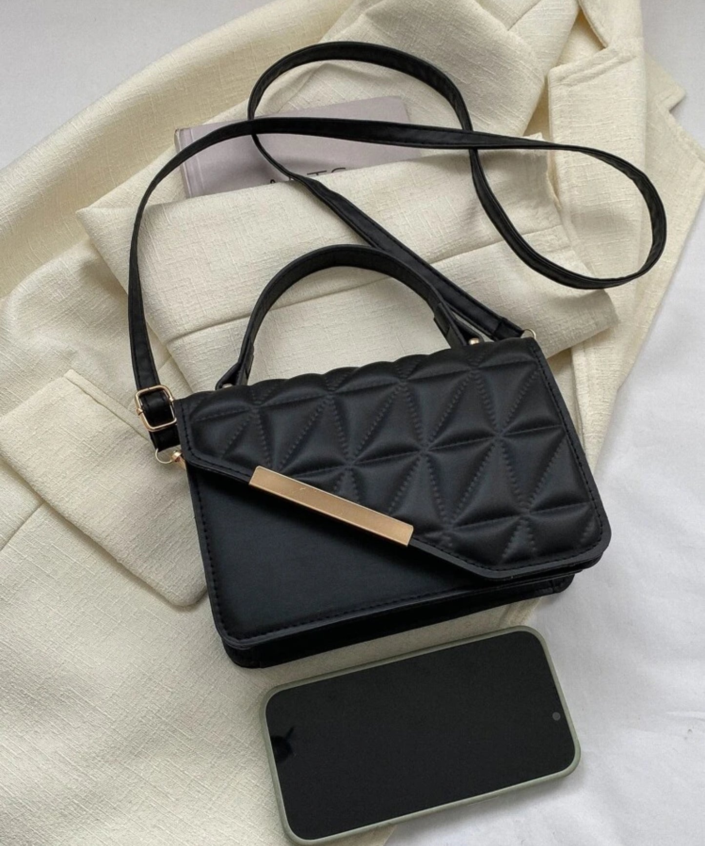 Black gold flap bag