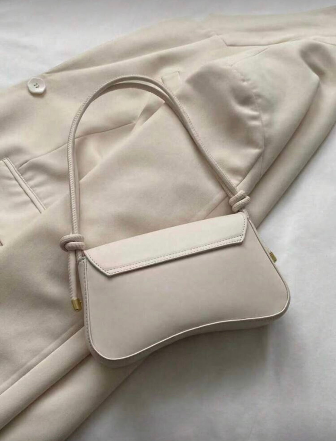 Mini cream baguette bag with gold detailing