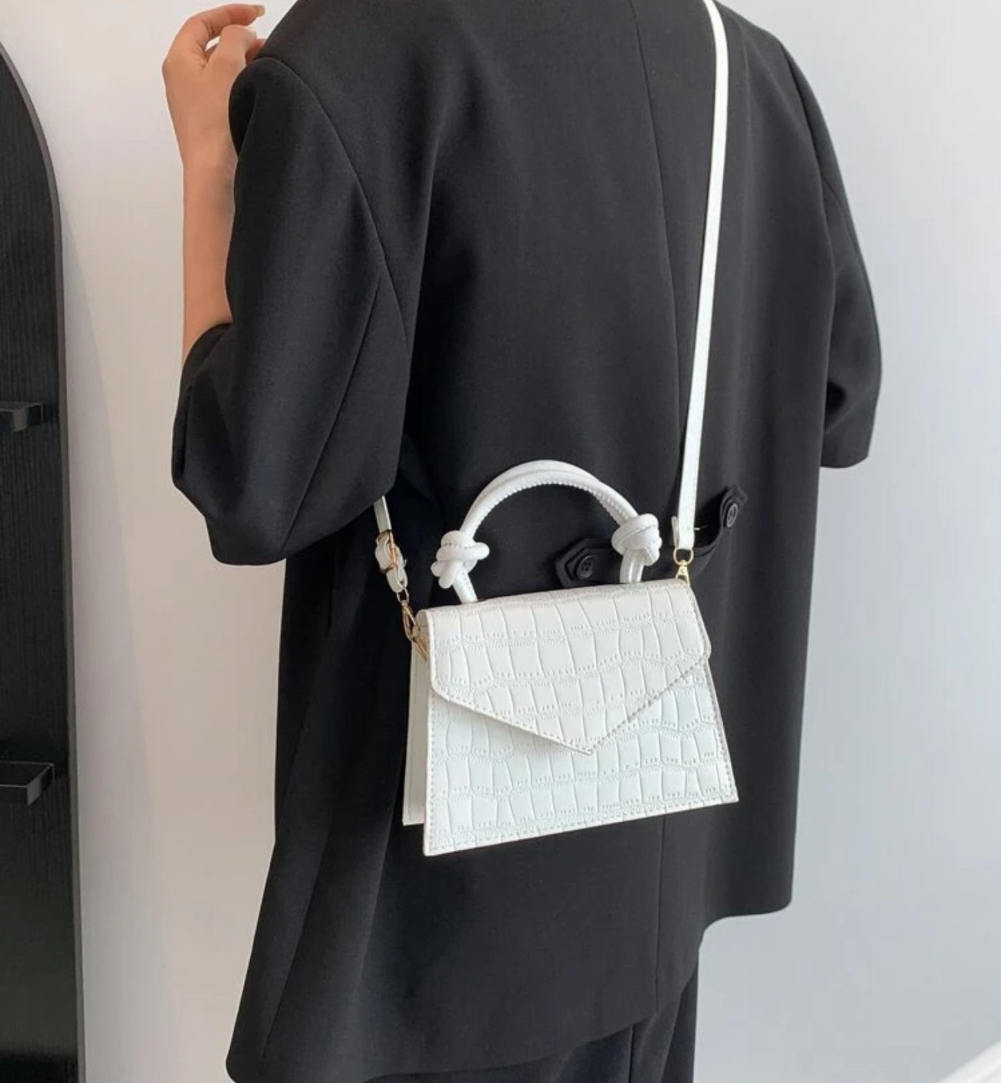 White rope handle clutch bag