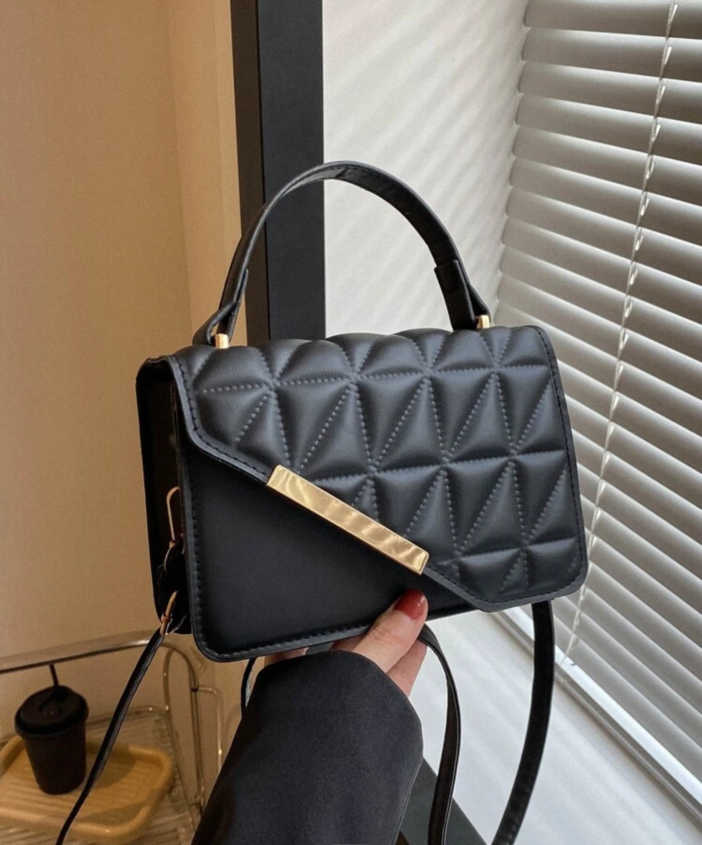 Black gold flap bag
