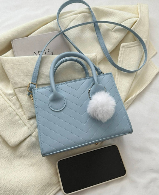Baby blue mini bag with pompom