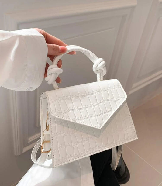 White rope handle clutch bag